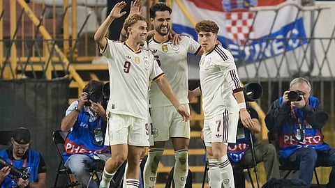 Mikel Merino, centre, celebrating with his teammates after scoring his goal.