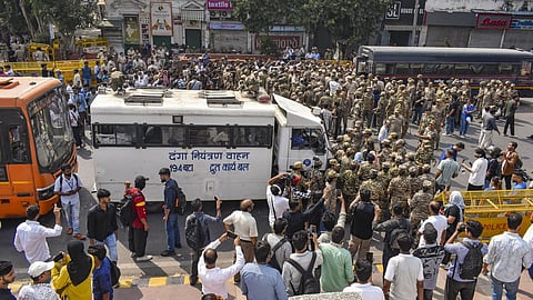 Security personnel deploy Rapid Action Force (RAF) anti-riot vehicles (Danga Niyantran Vahan) and assemble near barricades as demonstrators gather in Connaught Place during a protest organised by the Cockroach Janta Party (CJP) demanding the resignation of Chief Election Commissioner
(CEC) Gyanesh Kumar on October 10, 2026