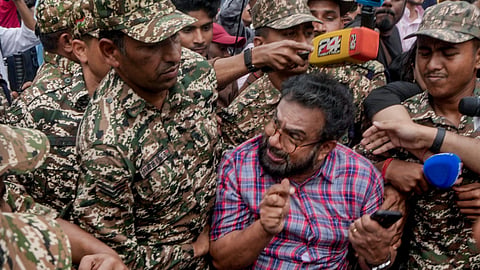 Police personnel detain CPI (M) MP John Brittas amid continued demonstration calls by the Cockroach Janta Party (CJP) demanding the resignation of Chief Election Commissioner (CEC) Gyanesh Kumar, in Connaught Place area, New Delhi, Sunday, Oct. 11, 2026