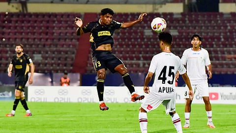 NorthEast United FC player and Mohun Bagan Super Giants FC player vie for the ball during the Indian Super League (ISL) football match between NorthEast United FC and Mohun Bagan Super Giants FC, in Guwahati, Monday, Oct. 12, 2026.