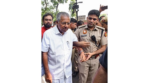 Former Keralam chief minister and CPI(M) leader Pinarayi Vijayan is detained during a protest near Kerala House, in New Delhi, demanding the resignation of Chief Election Commissioner (CEC) Gyanesh Kumar over alleged electoral roll irregularities