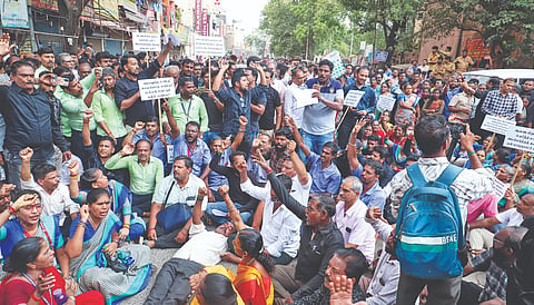 More than 500 shop owners protesting at Cemented Road junction, Royapuram, on Wednesday