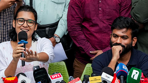 Cockroach Janta Party (CJP) founder Abhijeet Dipke and AISA President Neha Bora during a press conference at the Press Club of India, in New Delhi, Thursday, Oct. 15, 2026