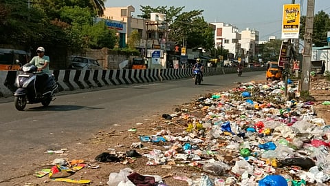Waste lying scattered along one side of the stretch near Lakshmipuram