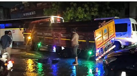 Unfilled excavated pits for Metro Water works on Tambaram-Velachery Road trap vehicles after heavy rain