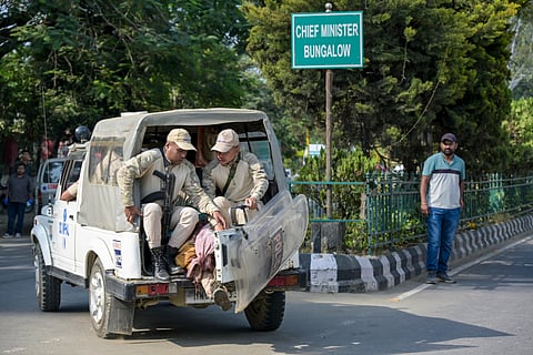 Imphal: Police personnel transport the bodies of two victims, who were allegedly killed in an ambush by armed miscreants while collecting firewood at Sunurok Uyok in Imphal East district, away from outside the Chief Minister�s bungalow towards a hospital mortuary, in Imphal, Monday, Oct. 19, 2026.