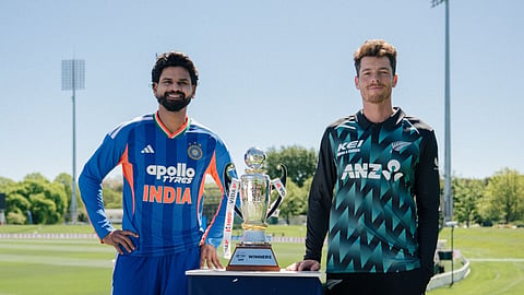 Indian captain Shreyas Iyer, left, and New Zealand captain Mitchell Santner pose with the trophy ahead of the first T20I cricket match, in Christchurch, New Zealand