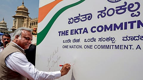Karnataka Home Minister Priyank Kharge signs a banner during the flagging-off of 'Ekta Parade- Motorcycle Rally Against Drugs', organised by the Karnataka Government and Karnataka State Police to raise awareness about drug abuse, in Bengaluru, Thursday, Oct. 15, 2026