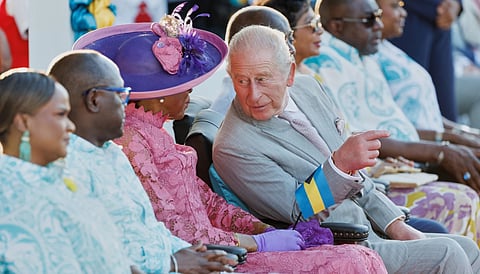 Britain's King Charles III chats with Governor General of The Bahamas Cynthia Pratt at The Future Bahamas Youth Rally and Exhibition at Clifford Park in Nassau