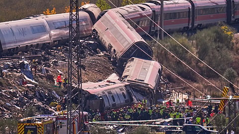 Emergency services work at the scene of a collision between two trains in Urda, Spain