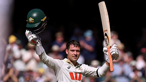 Alex Carey celebrates after reaching his century