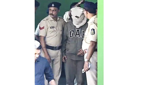 One of the Luthra brothers, co-owners of the Birch by Romeo Lane nightclub, being taken by police personnel to a court in connection with the December 6 fire incident that killed 25 persons, at Anjuna police station, in North Goa district, Wednesday, Dec. 17, 2025