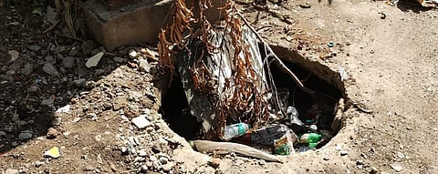 GCC staff covers the manhole (inset) at Venkataraman Street in Perambur
