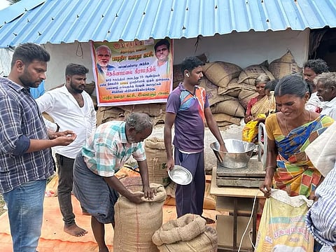 Cooperation Department staff distributing ration to villagers in Nekkanamalai bought by BJP youth wing cadre uphill recently in Tirupattur district