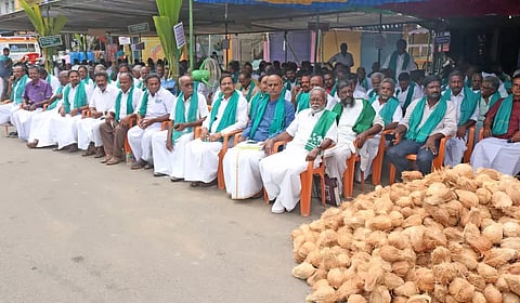 Coconut farmers staging a demonstration pressing their demand