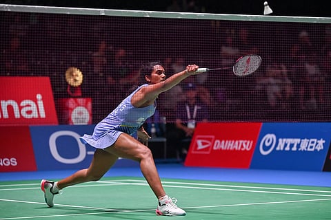 PV Sindhu hits a return against Zhang Yiman