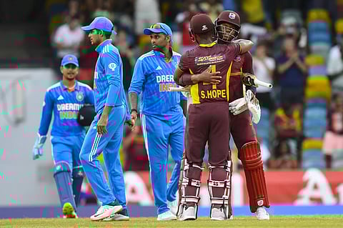 Shai Hope and Keacy Carty of West Indies embrace after their team’s win