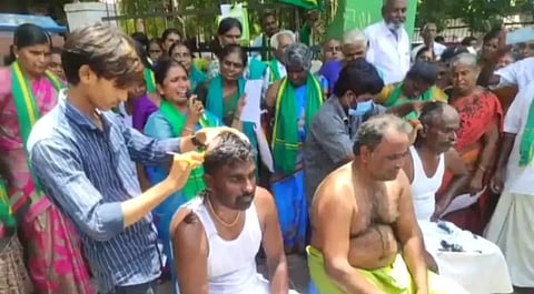 Farmers tonsuring their heads in protest against HR&CE move in Tirupur on Thursday