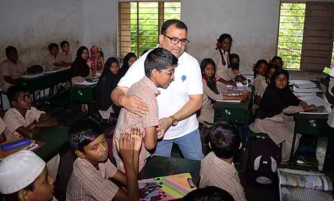 NHRC’s Goyal pats a student of GHSS