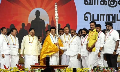 Minister EV Velu presenting a silver sceptre to CM MK Stalin at booth agents’ meeting in Tiruvannamalai on Sunday