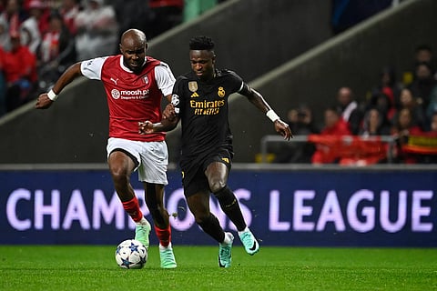 Sporting Braga’s Al Musrati fights for the ball with Real Madrid’s Vinicius Junior during their Champions League match