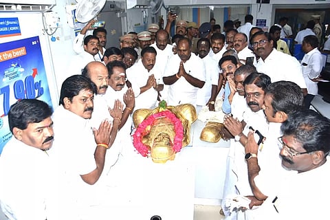 AIADMK leaders receiving the golden armour from Madurai bank on Wednesday