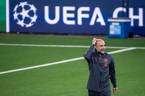 Pep Guardiola gestures at his players during a training session ahead of Sunday’s derby match