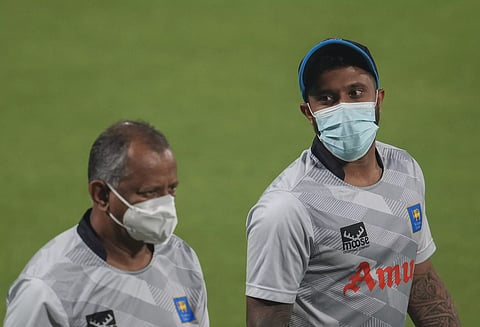 Sri Lanka captain Kusal Mendis (right) wears a mask during a practice session