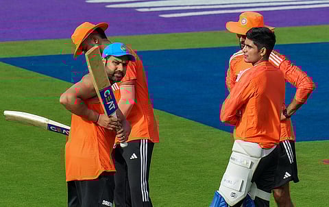 Rohit Sharma, Shubman Gill and coach Vikram Rathour during a practice session