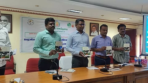 Collector PN Sridhar releases a manual on agroforestry at a programme in Nagercoil