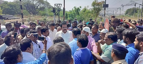 Residents stop work on railway foot-over bridge at Vasanthapuram