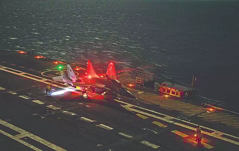 A MiG-29K aircraft on the deck of INS Vikrant after making the maiden night landing.