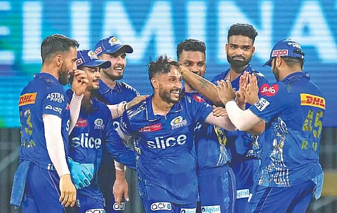 Akash Madhwal (centre) rose to the occasion on Wednesday taking five wickets against LSG.