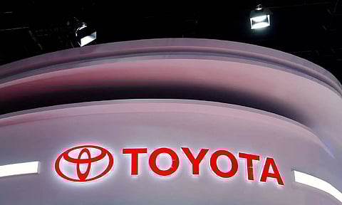 The Toyota logo is seen at its booth during a media day for the Auto Shanghai show in Shanghai.