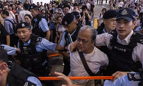 A public member taken away by the cops. AP