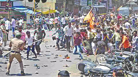 Security personnel disperse people protesting against the alleged use of Tipu Sultan’s image in an objectionable social media post, in Maha’s Kolhapur district, on Wednesday