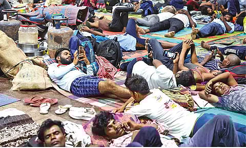 People evacuated from Kandla port at a shelter on Tuesday