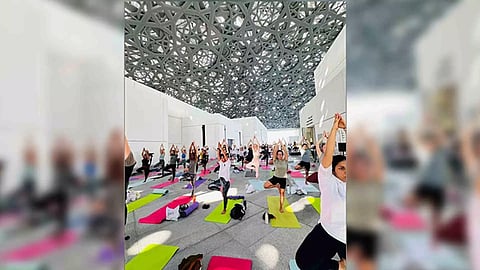 People performing Yoga during an event at the Louvre Museum, Abu Dhabi on Saturday (Photo: ANI)