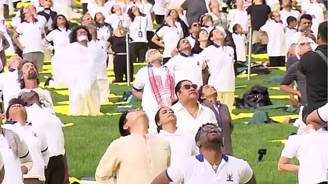 The prime minister, wearing a customised white yoga T-shirt and trouser, thanked people for coming here from far away to attend the celebration