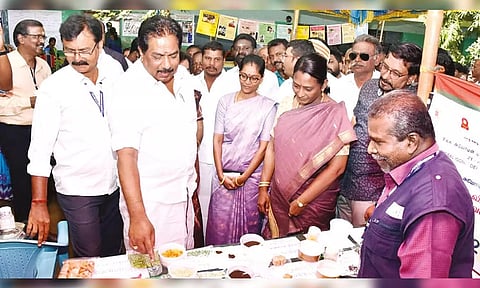 Minister for Commercial Taxes and Registration P Moorthy inspects a stall at the multi-specialty health camp in Madurai on Saturday