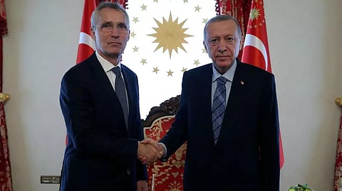 Turkey's President Tayyip Erdogan shakes hands with NATO Secretary General Jens Stoltenberg in Istanbul