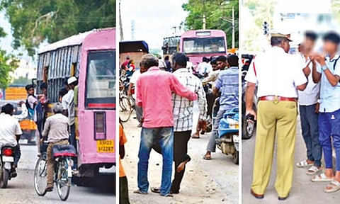 Students on footboard attack cyclist, two-wheeler rider before giving a slip