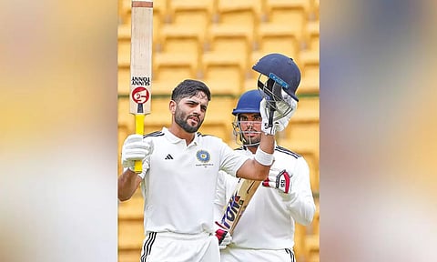 Dhruv Shorey celebrates scoring a ton