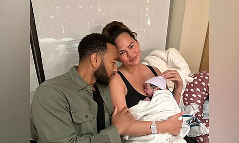 Crissy Teigen, John Legend and their child
