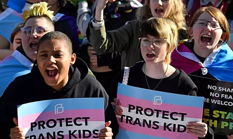  Protesters of Kentucky Senate Bill SB150, known as the Transgender Health Bill, cheer on speakers during a rally on the lawn of the Kentucky Capitol in Frankfort, Ky., March 29, 2023. A federal judge temporarily blocked Kentucky’s ban on gender-affirming care for transgender youths on Wednesday, June 28, taking the action shortly before the measure was set to take effect.(Photo: AP)