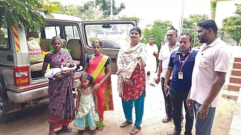 Tribal woman along with government officials
