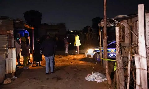 Police guard the site of a suspected gas leak on July 6 near Boksburg, South Africa (Reuters)