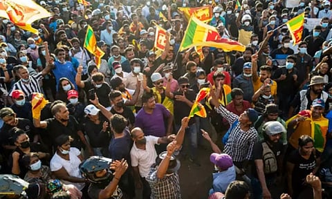 People shout slogans during an ongoing anti-government demonstration outside the president's office in Colombo. (AFP)