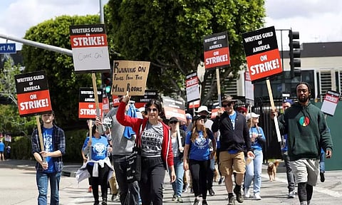 Workers and supporters of the Writers Guild of America protest outside Universal Studios Hollywood