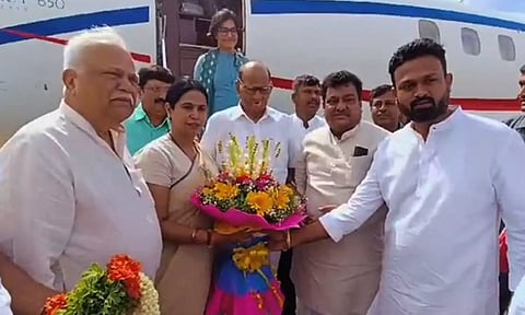 Ministers MB Patil and Laxmi Hebbalkar received the NCP supremo at the airport. (IANS)